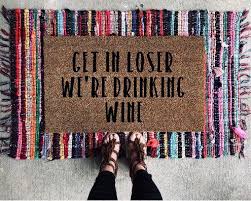 Get In Loser We Re Drinking Wine Funny Doormat Mean Girls New Homeowner Gift Ideas Welcome Mat Doormat Welcome Mats Door Mat Funny Doormats