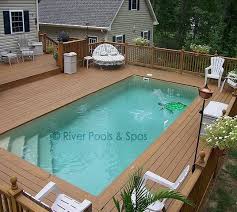 Above Ground Fiberglass Pools Can And Should They Be Built Above Ground Fiberglass Pools Swimming Pool Decks Fiberglass Swimming Pools