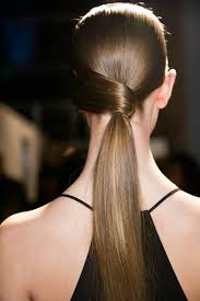 You shouldn't have to work too hard to rock this one. 2 Quick Tricks To Hide Your Hair Tie