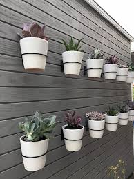 Pin By Elizabeth Gordon Studio On Vertical Garden Inspiration Hanging Plants Outdoor Plant Pot Holders Wall Planters Outdoor