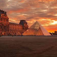 The Louvre Museum in Paris France during sunset on a day off in August.  Just set up my tripod in the corner and was waiting to get as empty as  possible there