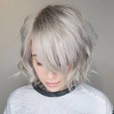 Short, pixie, blonde hairstyle with shaved side and longer bangs. Pin On Birthday Ideas