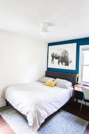 This metallic trend has been a popular interior design choice that truly this dark blue grey wall totally looks green, but looks incredible in this master suite. Grown Up Kids Bedroom With A Blue Accent Wall Live Free Creative Co