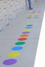 Volunteer group paints to promote physical activity for children