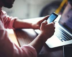 صورة person using mobile phone for work