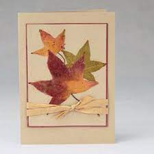 Paper scraps blended to a pulp, seeds mixed in, dried out and cut into shapes. Using Dried Leaves To Decorate Greeting Cards Leaf Crafts Leaf Cards Dry Leaf Art