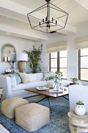 Chic Coastal Living Room With Touches Of Blue And Light Blue Farm House Living Room Coastal Living Room Coastal Living Rooms