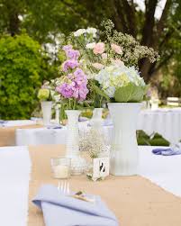 A tablecloth is a great way to give your dining room table a little personality when you aren't hosting. White Vase Dining Table Centerpiece