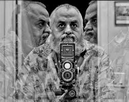 What are the characteristics of a 1987 North Vancouver shipyard photo taken  with a Rolleiflex 3.5F Planar and Kodak Tmax 100 film?