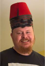 Why Does Tin Fished Review Wear A Fez