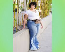 These aren't your grandma's bell bottom jeans. 10 Ways To Wear Flared Jeans That Feel Modern And Fresh
