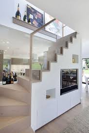 Under stairs space is a great corner of your home, which is often understated and not used while you can make a lot of nooks there: 31 Living Room Under Stairs Storage Ideas Shelterness