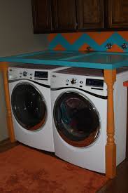 Chevron Wall With An Old Door For A Folding Table Above Washing Machine And Dryer Fun Laundry Room Old Door Chevron Wall Folding Table
