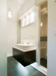Fish scale tile is a hot bathroom trend and using it on a small shower accent wall is a great way to elevate your bathroom in a very subtle way. How To Take Advantage Of Floating Vanities To Make Bathrooms Spacious Bathroom Design Small Modern Bathroom Sink Design Modern Bathroom Design