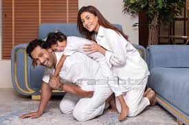 Son rides dads back as mom joins in playfully