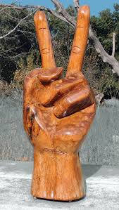 His talent is evident in the delicate detailing of the hand sculpture as he transforms suar wood into the peace sign. Massive 40 Hand Carved Peace Sign 1971 Vietnam Vet Bring Back Collectors Weekly
