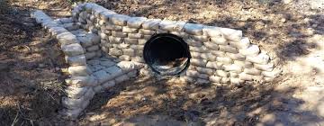 Holes should be no less than six inches away from the edge of the concrete. An Easy Way To Build Retaining Walls Leave The Concrete In The Bag Stack Like Legos Wet With A Hose Core77