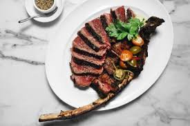 A kobe beef steak is being precisely cut on the hot plate. The Most Expensive Steaks In America Restaurants Food Network Food Network
