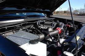 Proceeds to pull up the back seat, then there is a bottle of nos under it. Trd Supercharger Tacoma World