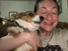 Puppy snuggling with mom