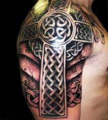 Celtic cross tattoos carried on him arm with fine white detailed knot work. Pin On Cross Tattoos For Women