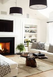 In this living room, the black and white wall art stands out against a neutral wall color. Simple Sophisticated Black White And Wood Inspiration Apartment Therapy