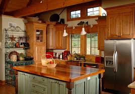Wide view of oak kitchen cabinets, a wood floor, stainless kitchen appliances, and empty countertop. Oak Kitchen Cabinets All You Need To Know