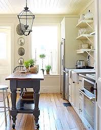 Small Linear Kitchen With A Vintage Island Small Cottage Kitchen Kitchen Remodel Software Farmhouse Kitchen Cabinets