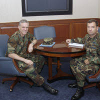 With the Tampa skyline in the background, US Air Force MASTER Sergeant Alex  Aceves and his wife, Starr, take a weekend stroll along MacDill's Bayshore  Boulevard with their children, Alex, 14 and