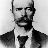 George Kessler. Formal seated portrait, subject facing front