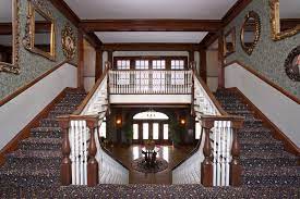 The Owner S Hall The Grand Staircase Features Portraits Of Past Owners Of The Hotel And Influential People Involved In T The Stanley Hotel Haunted Hotel Hotel