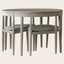 round table with four chairs (three