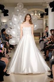 A traditional wedding dress with just a hint of drama; Wedding Bridesmaid Dresses By Oleg Cassini Spring Summer 2018