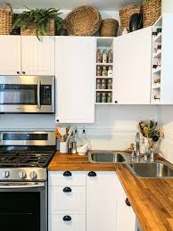 Decorating Above Kitchen Cabinets With Baskets And Plants 2836 In 2020 Above Kitchen Cabinets Decorating Above Kitchen Cabinets Top Kitchen Cabinets
