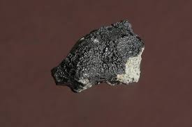 This could have been the result of an impact of a celestial body on mars, sending material from mars into space. Traces Of Possible Martian Biological Activity Inside A Meteorite