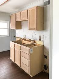 Painting kitchen cabinets is a straightforward diy task that makes a major impact. Unfinished Wood Cabinets To Make The Flip House Kitchen Beautiful
