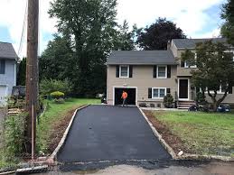 It's traditionally done with bricks or pavers but there are a number of options, all of which really accentuate and frame a bitumen driveway. New Driveway With Extension And New Sidewalk In Livingstone Nj Maloney Paving And Masonry