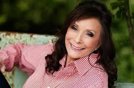 A bear is being hugged by a flower