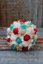 A white wedding bouquet of king proteas, white roses, berries, magnolia leaves and pale greenery. Gypsyfarmgirl Little Mermaid Meets Burlap And Lace