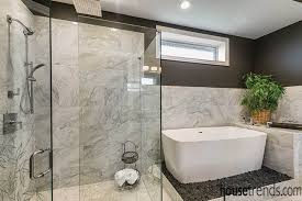 The layout of this bathroom was reconfigured by locating the new tub on the rear wall, and putting the toilet on the left of the vanity. Modern Marvels In Bathroom Designs