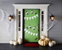 30 Monster Doors And Monster Wreaths To Greet Trick Or Treaters This Halloween Halloween Diy Door Halloween Porch Decorations Halloween Door Decorations