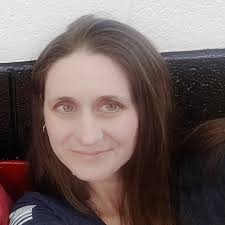 Is my Cane Corso blocking my female Pitbull from playing with my  Lab/Pitt/Mastiff mix due to resource guarding or dominance issues?