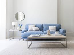 Even a small foyer table can hold its own by adding a simple lamp and an orchid in a decorative pot. Parker Coffee Table Loaf Modern Living Room Homify