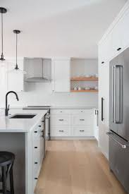 From Show Home To Style And Flow Rue White Kitchen Design Black Kitchen Faucets Wood Floor Kitchen