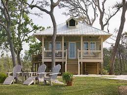 Beach houses are typically built at the waterfront and prominently feature large windows on at least one side, meant to capture the best of the surrounding scenery and make the most out of your property. Small Beach Cottage House Plans Florida Gulf Coast Cottages Homes Home Luxury Mediterranean Designs Rumah Kebun Rumah Kecil Bungalo