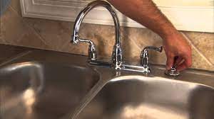 Lift out the sprayer hose. How To Install A Two Handle Kitchen Faucet The Home Depot
