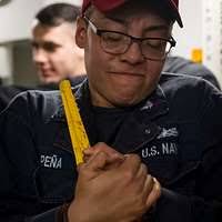 Aviation Ordnanceman 3rd Class Clayton Townsend, from Elko, Nev., and  Aviation Ordnanceman 3rd Class Laticia Workman, from Yuma, Ariz., repair a  transfer unit.
