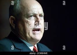 Baseball hall of fame pitcher NOLAN RYAN poses in downtown Alvin, Texas,  next to a statue of himself pitching. The bronze statue was made by  sculptor Jack Bryant and unveiled in 1992