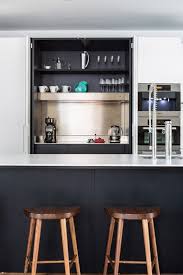 I love the rustic industrial design, concrete countertop, and lit display cabinet. 5 Kitchen Coffee Station Ideas To Optimize Your Caffeine Routine