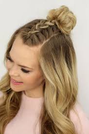 A braided half updo that you can actually braid yourself! Trend Watch Mohawk Braid Into Top Knot Half Up Hairstyles Hair Styles Overnight Hairstyles Braided Hairstyles